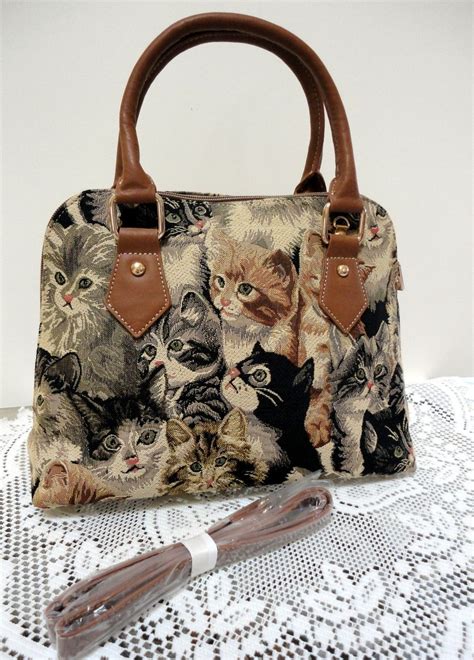 coach handbag with cats.